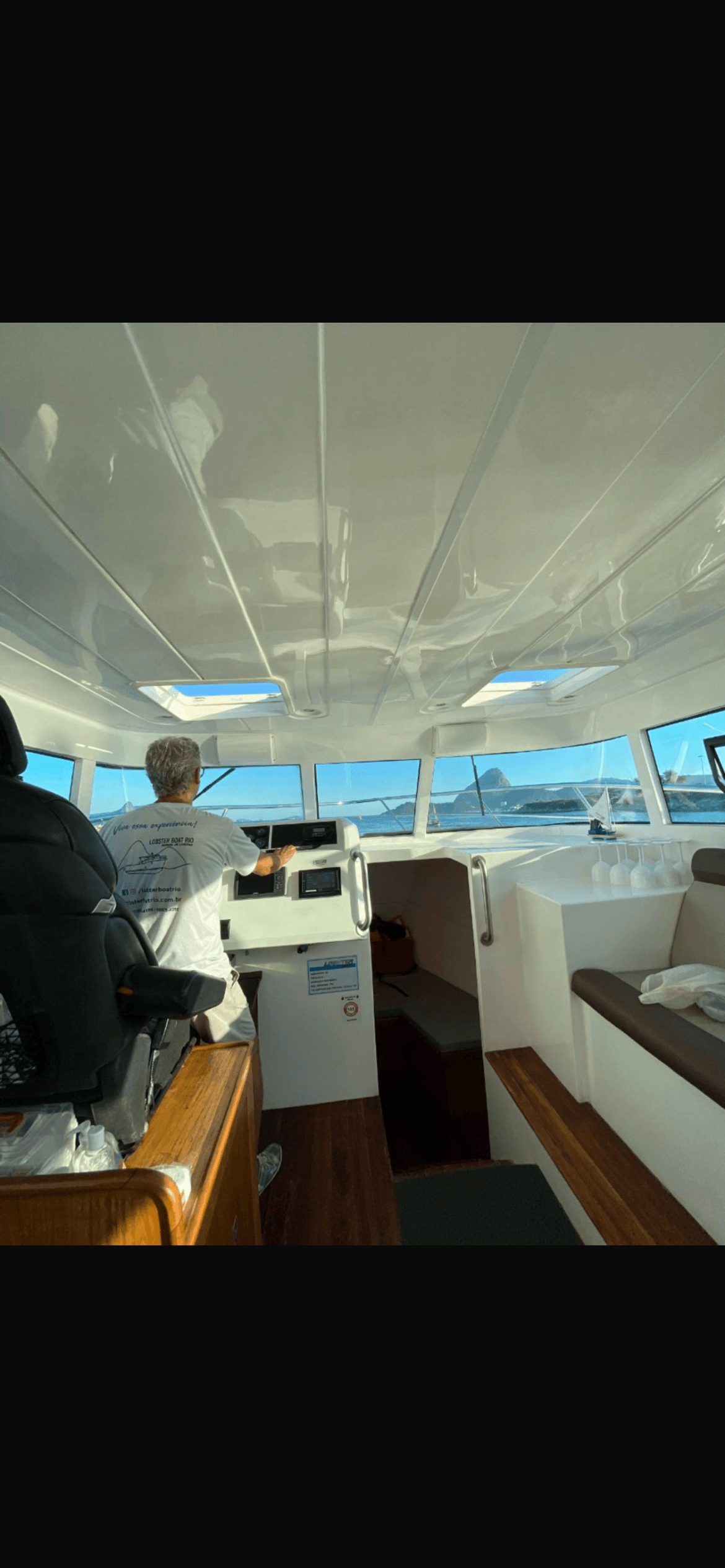 Lobster 400 interior helm station with view of Sugarloaf Mountain