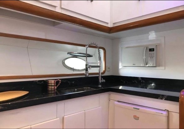 Aquarius 60 kitchen with white cabinets and black countertops