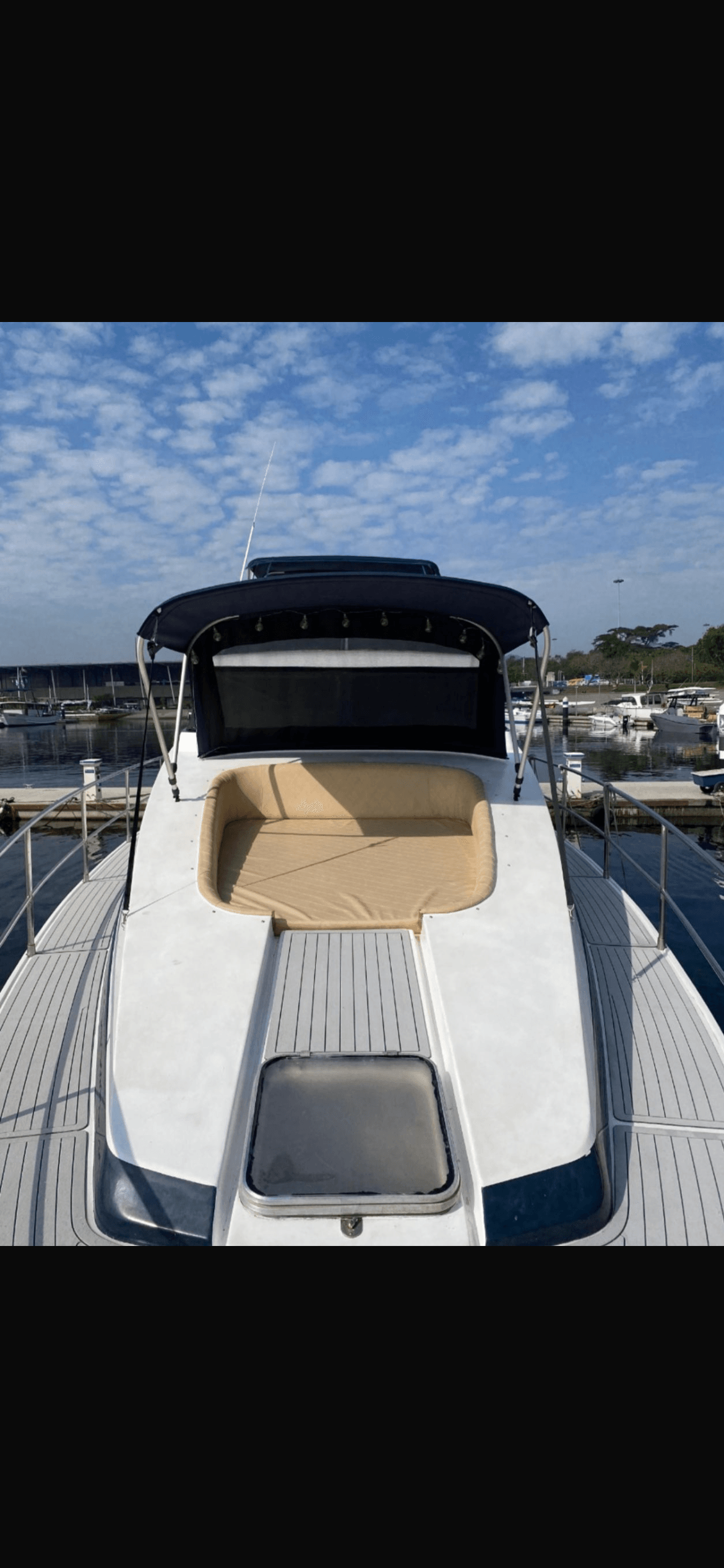 Aquarius 60 rear deck with sunbathing area and beige cushions