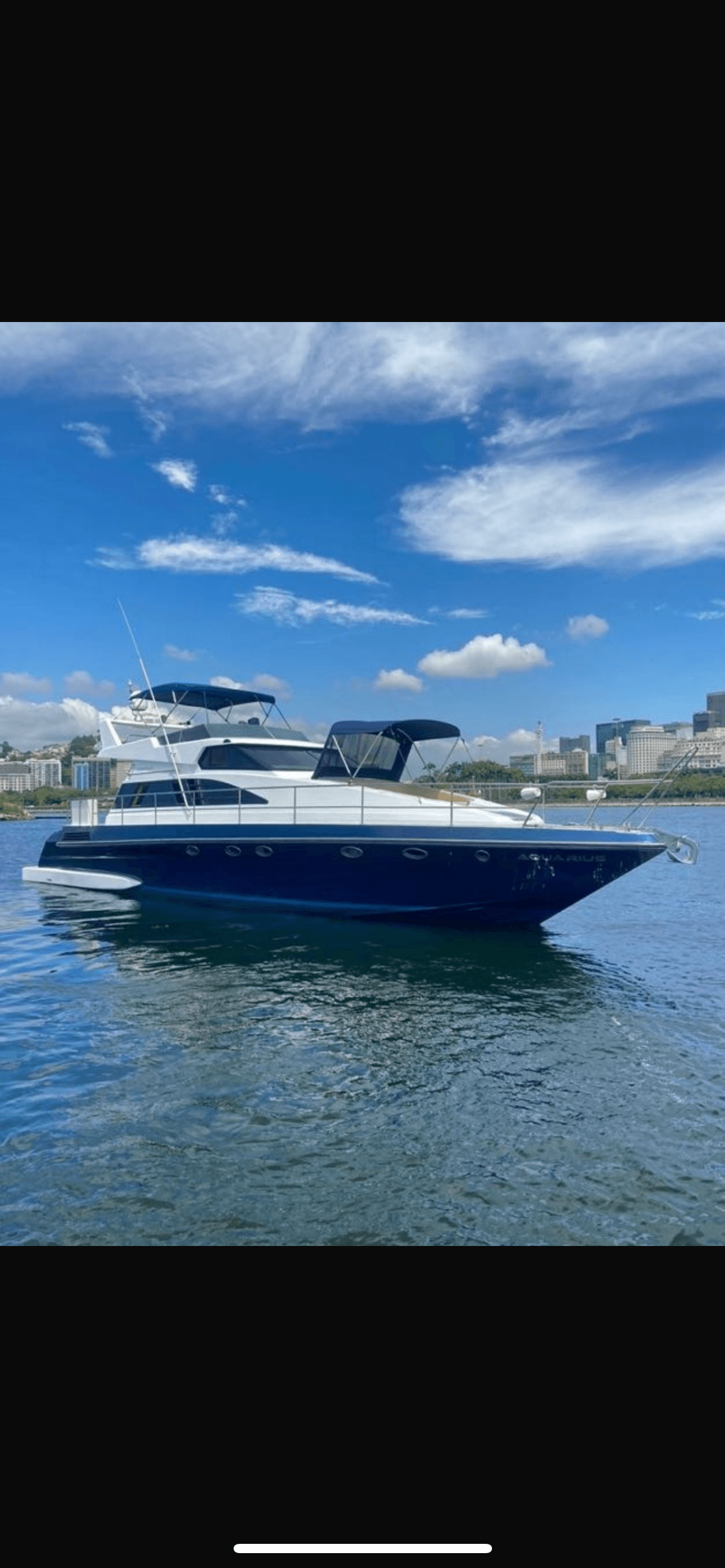 Aquarius 60 yacht exterior view with blue hull and white upper structure