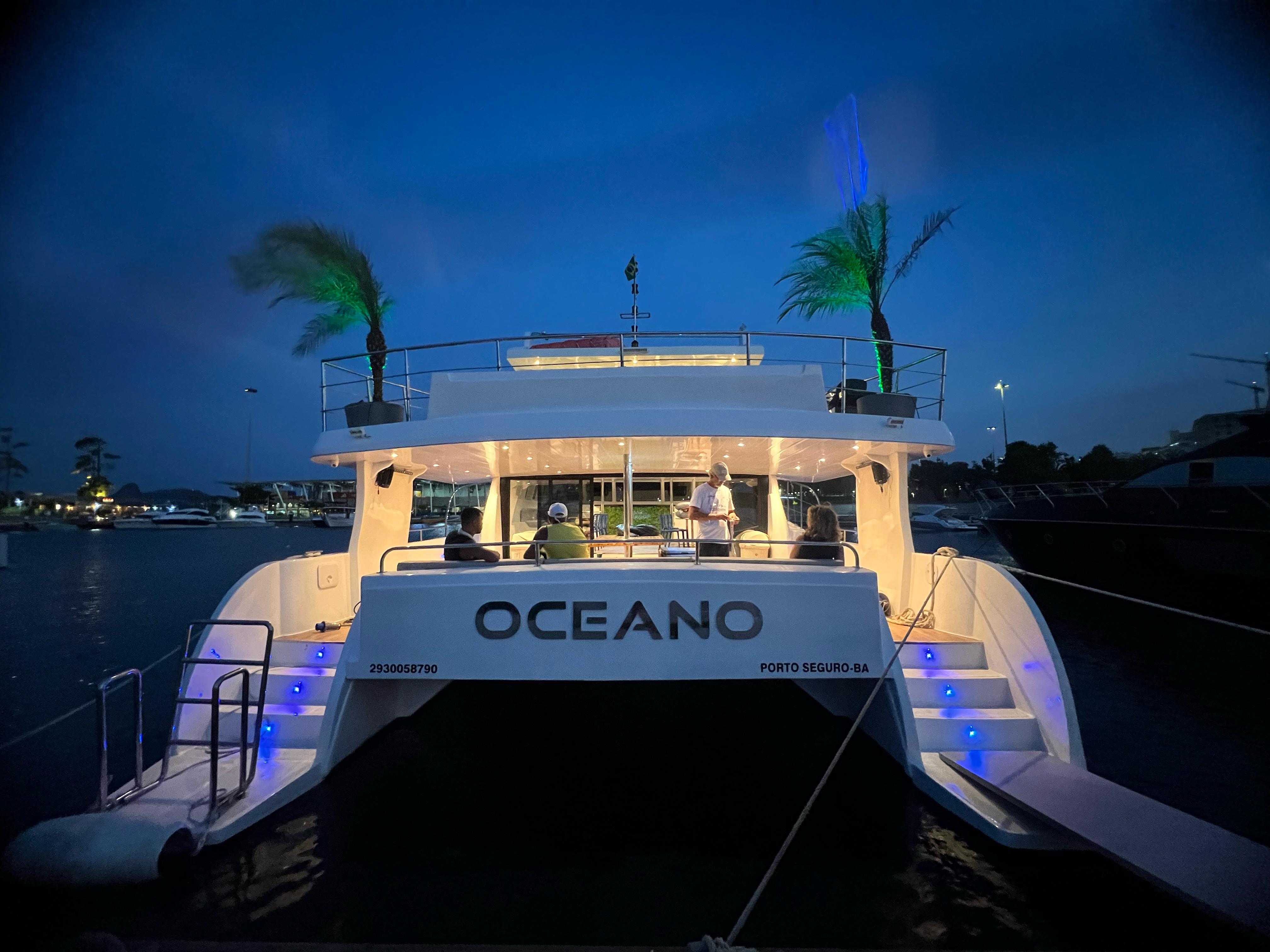 Oceano catamaran rear view at night with blue LED lights