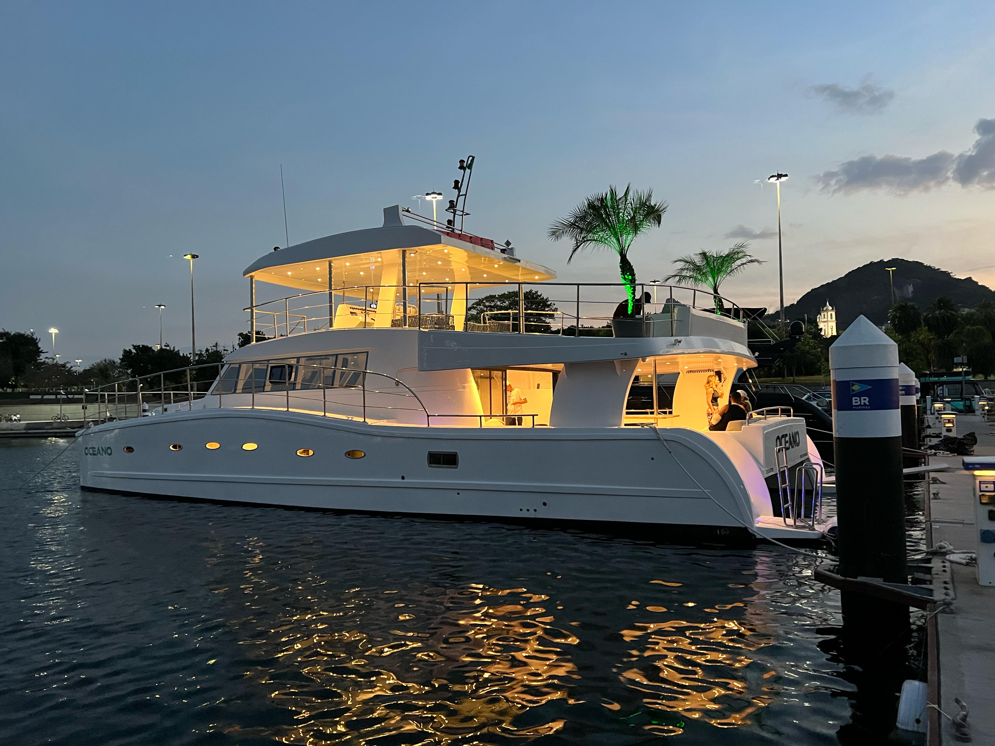 Oceano catamaran side view at sunset docked at marina