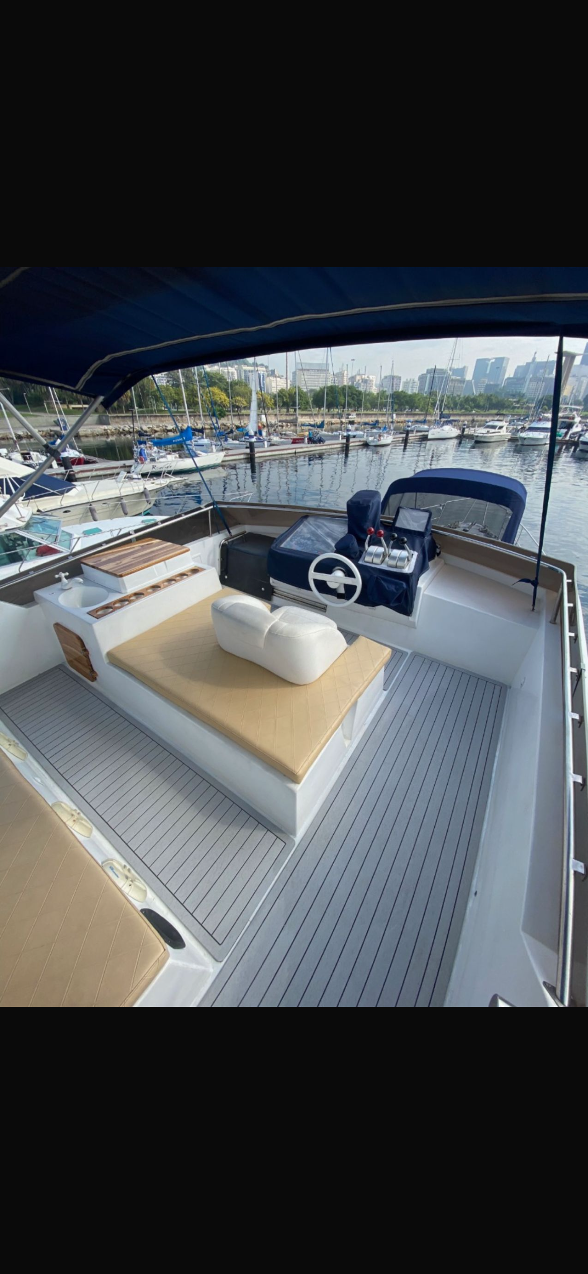 Aquarius 60 flybridge with seating area and steering controls